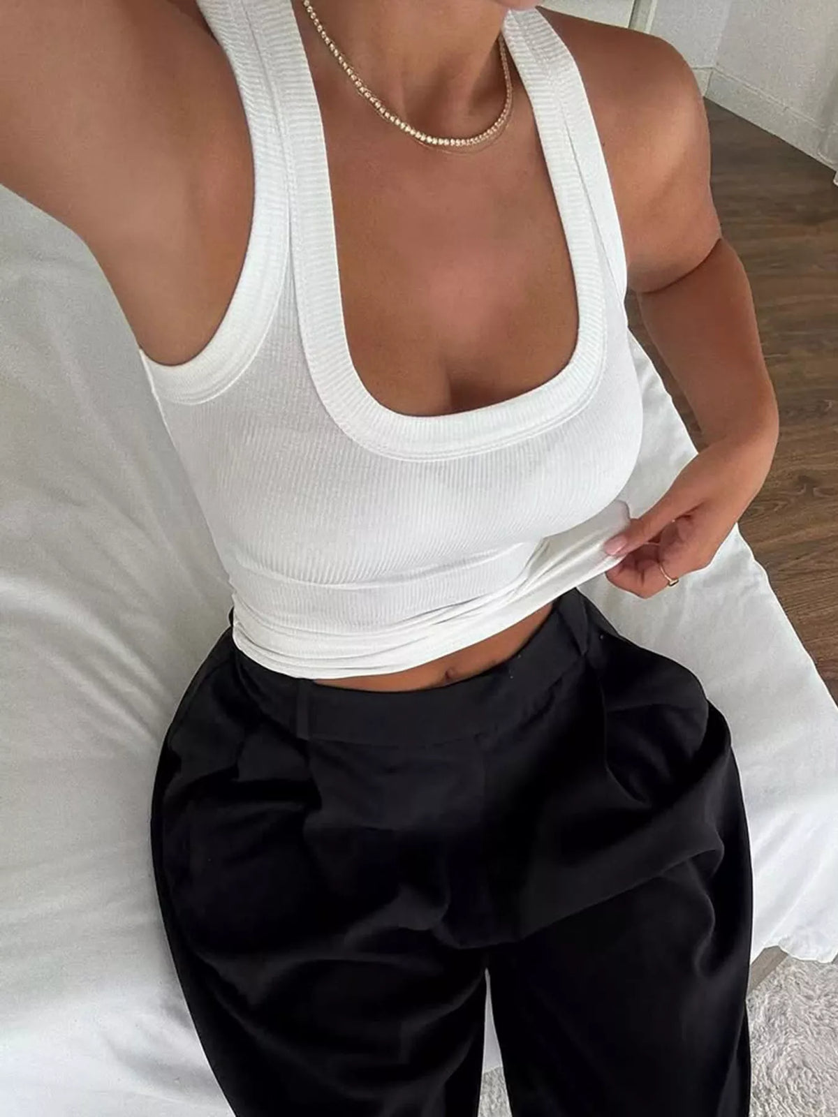 White ribbed slim-fit tank top street outfit with jeans and a jacket